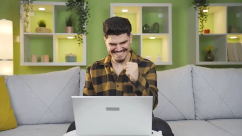 Home office worker man delighted with what he saw on laptop. Stock Footage 237795359