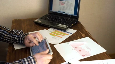 Home office worker using tablet and laptop Stock Footage 62440230