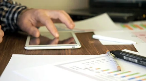 Home office worker using tablet and laptop Stock Footage 62440520