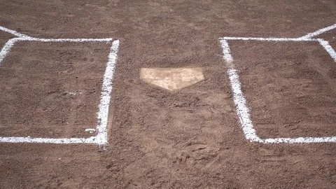 Home plate and a chain link fence at a little league baseball game. Stock Footage