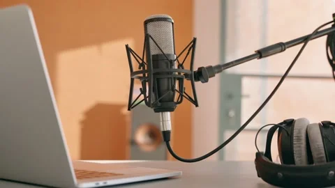 Home recording studio gear with computer headphones and microphone on desk Stock Footage 218475945
