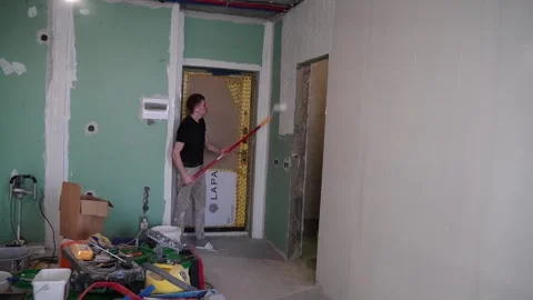 Home renovation project in progress with painting and wall work in a residential Stock Footage 331245309