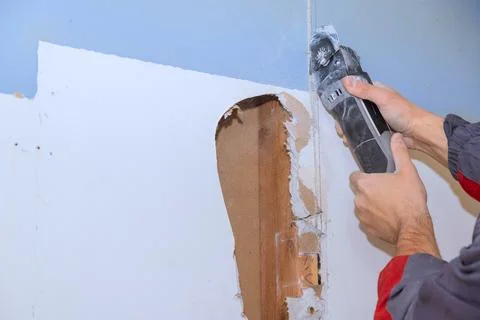 Home renovation project with using tool to cut wall material Stock-Fotos