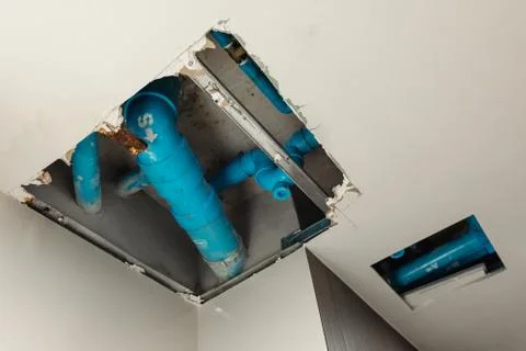 Home residential problem, Damage ceiling in restroom Stock Photos