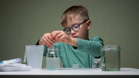 Home schooling concept. First school day. Young boy doing his school homework Stock Footage 139845460