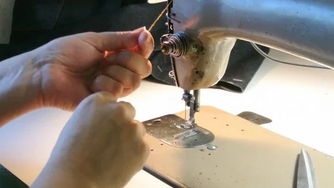 Home seamstress preparing the sewing machine to work. Dressmaker getting ready. Stock Footage 82257740