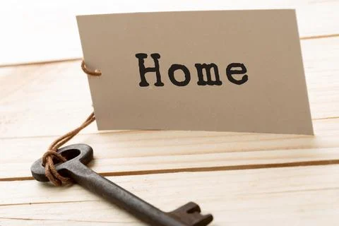 Home security concept - old key with tag Stock Photos