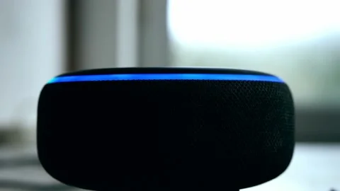 Home smart voice device in home lighting up Stock Footage 221438217