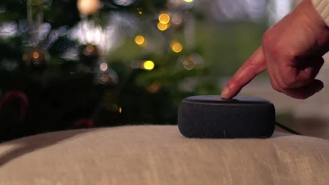 Home smart voice device playing in Christmas background Stock Footage 259871388