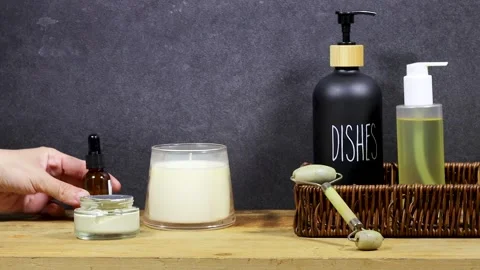 Home Spa Essentials On Bathroom Shelf With Towels, Oils, Pump Bottle, Diffuser S Video stock 327730971