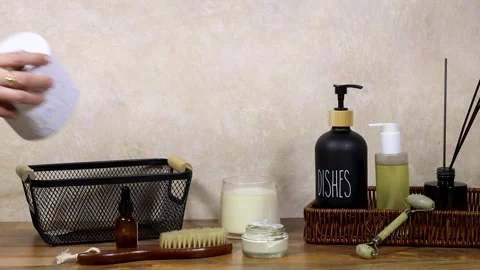Home Spa Essentials On Bathroom Shelf With Towels, Oils, Pump Bottle, Diffuser S Video stock 327730997