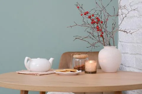 Home spring easter design in kitchen. White teapot, plate with cookies, ceramic Stock Photos