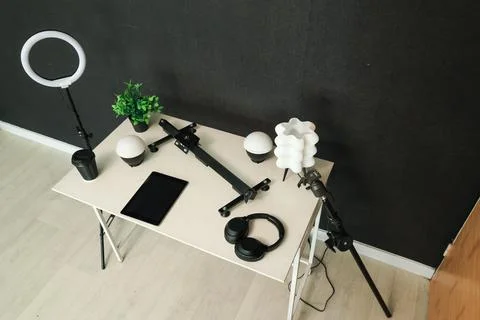 Home studio setup with ring light, tablet, headphones, and microphone stand Stock Photos