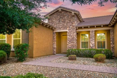 A home at sunset Stock Photos