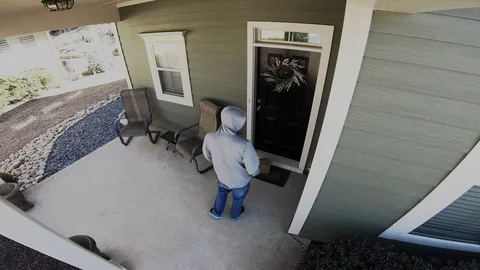 Home Surveillance Footage of Porch Pirate Stealing Package Stock Footage