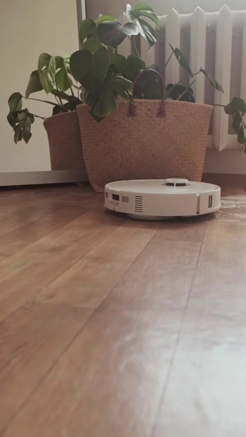 Home technology robot cleans the floor while you work saving time for your Stock Footage 314641898