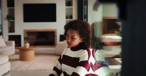 Home, thinking and kid with depression by window, adoption crisis and loneliness Stock Footage 335528131