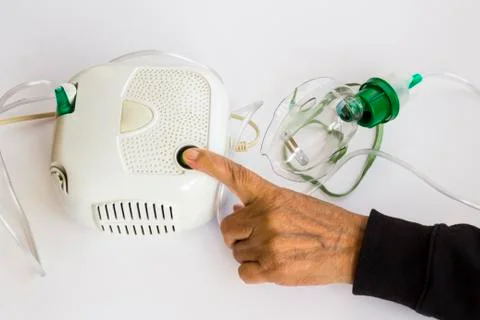 Home type mini air machine with oxygen mask on white Stock Photos