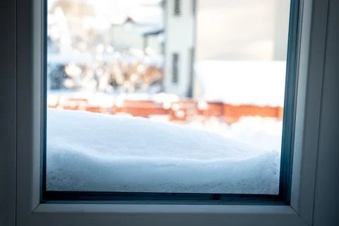 Home window from the inside. Behind the window snow compartments Stock Photos