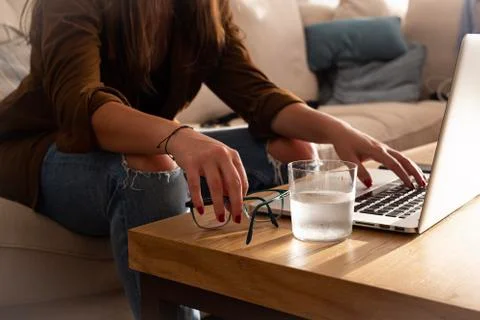 Home work space - work from home concept - girl working or studying with a la Stock Photos