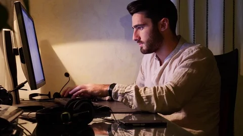 Home worker sitting at desk using touchscreen computer Stock Footage 81224391