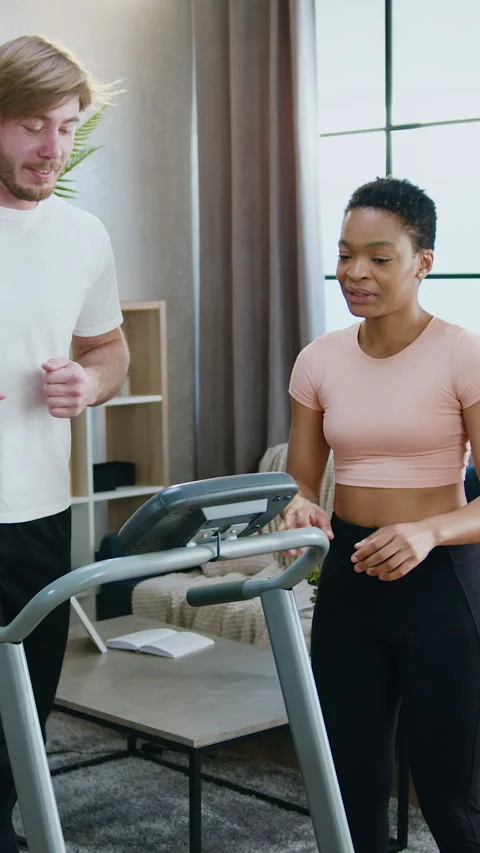 Home workout concept where beautiful active sporty african american woman suppor Stock Footage 328593069