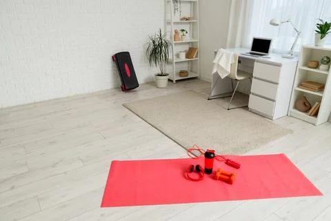 Home workout setup with exercise mat and fitness equipment Stock Photos