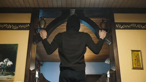 Home workout. Wide pullups in a living room. Stock Footage 106012532
