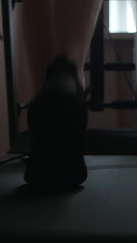 Home workouts on the treadmill are the key to good health and a strong body. Stock Footage 305570691