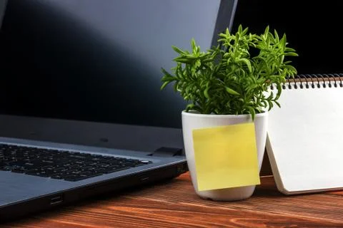 Home workplace with computer, blank notepad, copy space close up Stock Photos