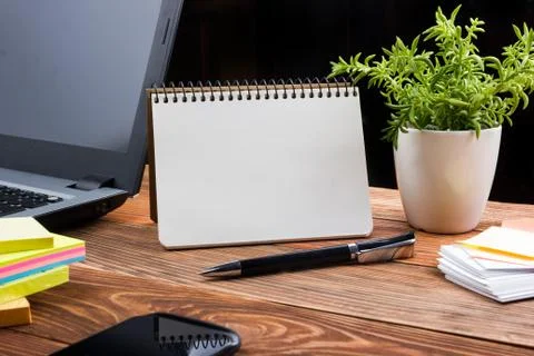 Home workplace with computer, blank notepad, copy space close up Foto stock