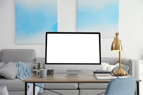 Home workplace with modern computer and desk in room. Mockup for design Stock Photos