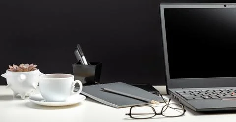 Home workspace for work or study in Office interior. Black laptop on white table Stock Illustration