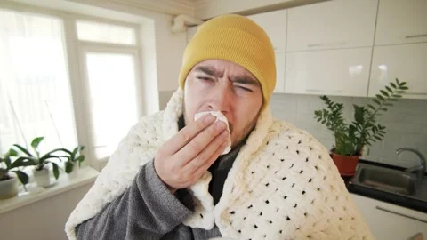 Homebound Struggle Young Man Suffers from Seasonal Flu Vídeo Stock 325717995