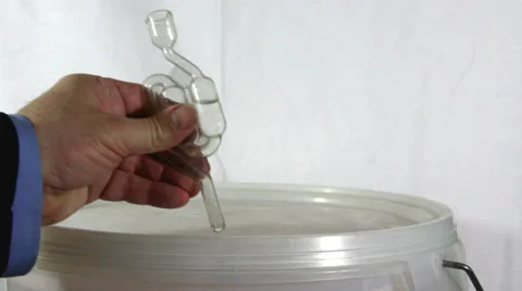 Homebrew wine  kit - fitting the fermenter airlock Stock Footage 35789973