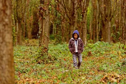 Homeless and abandoned. Homeless child walk in woods. Homeless boy without Stock Photos