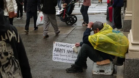 Homeless army vet on street, New York City. Stock Footage