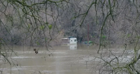 Homeless camp on river in winter Stock Footage 297406524