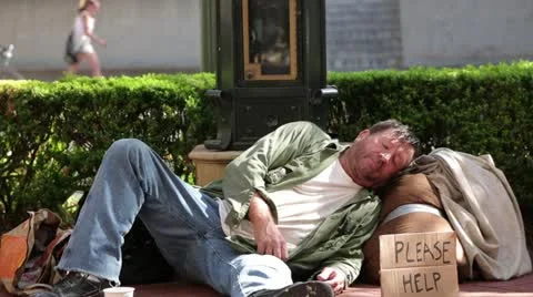 Homeless Drunk Man Falling Asleep on Sidewalk - Model Released Stock Footage 11904804