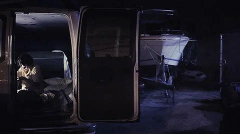 Homeless inside a van Stock Footage