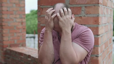 A homeless man asks for help donating money for food. A man is depressed. Video stock 304032677