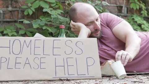 Homeless man asks for help donating money for food. Man dreams of his own house. Stock Footage 306088906