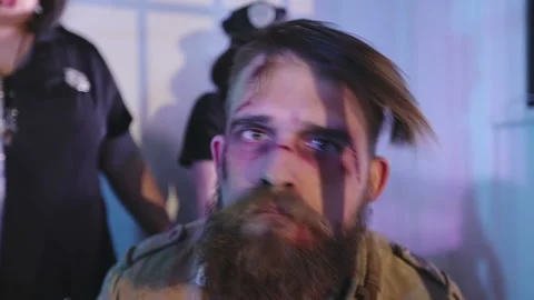 A homeless man with a beard dances in the prison cell. Stock Footage 89628628