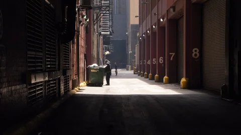 A Homeless Man Checking the Garbage Bin in Chicago Stock Footage 111328719