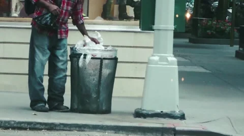 Homeless Man Digging in Garbage Video stock 41865426