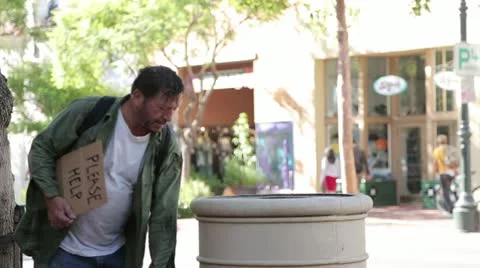 Homeless Man Digging through a Trash Can - Model Released Stock Footage 11902298