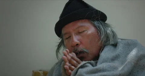 Homeless man is feeling cold at the outside and begging for money Stock Footage 148004930