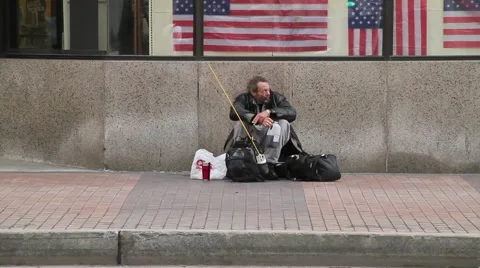 Homeless man in inner city Stock Footage
