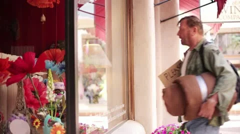 Homeless Man Looking into Store Window - Model Released Stock Footage 11896355