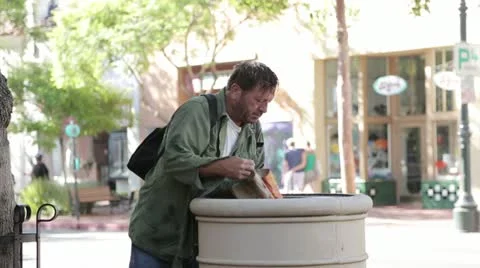 Homeless Man Looking through Trash - Model Released Stock Footage 11977508